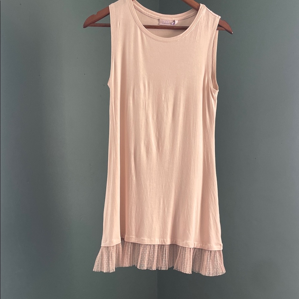 Sleeveless Cream Top with Ruffle Hem